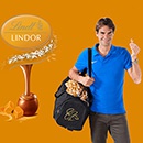 Акция шоколада «Lindt» (Линдт) «Выиграй сумку с автографом Роджера Федерера, полную LINDOR Caramel!»